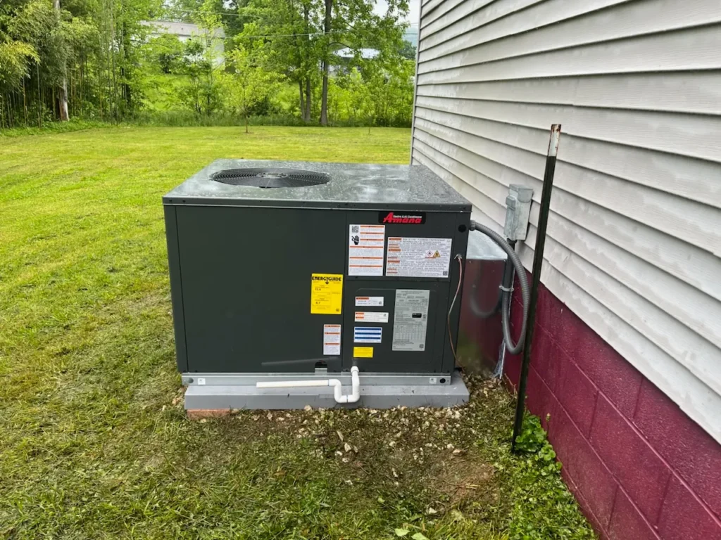 ThermoSTAT Heating & Cooling specialist repairing home furnace, trusted HVAC service