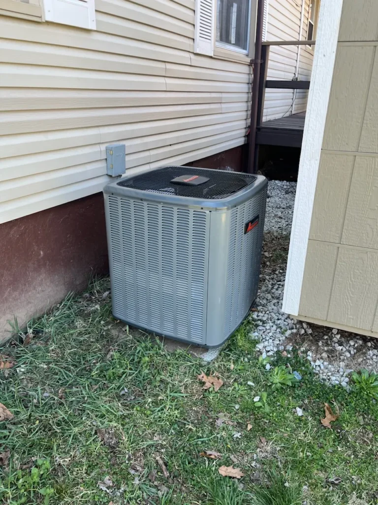 Trusted ThermoSTAT specialist servicing home HVAC system during maintenance